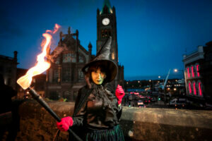 a witch with a fire stick in her hand October in Ireland