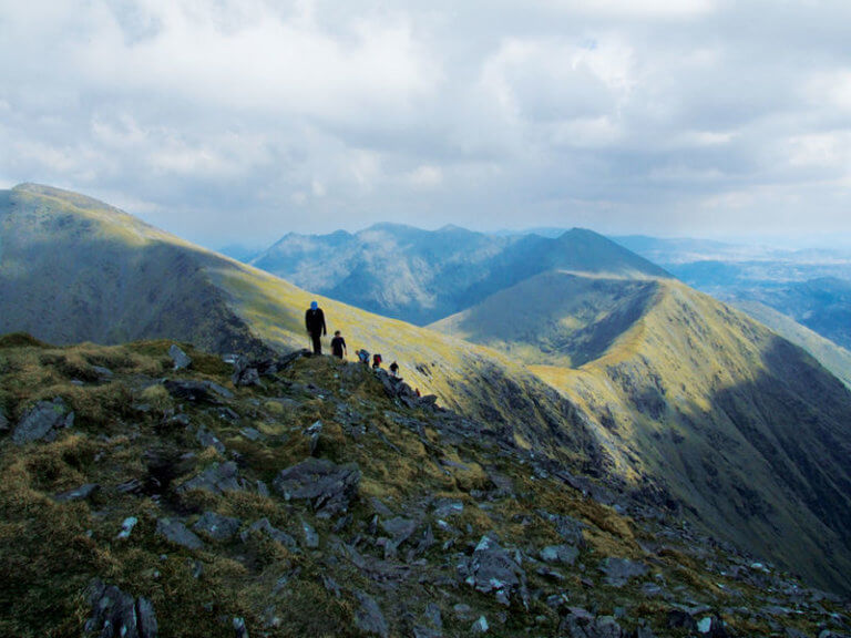 people walking on a mountain The Top 10 Irish Experiences