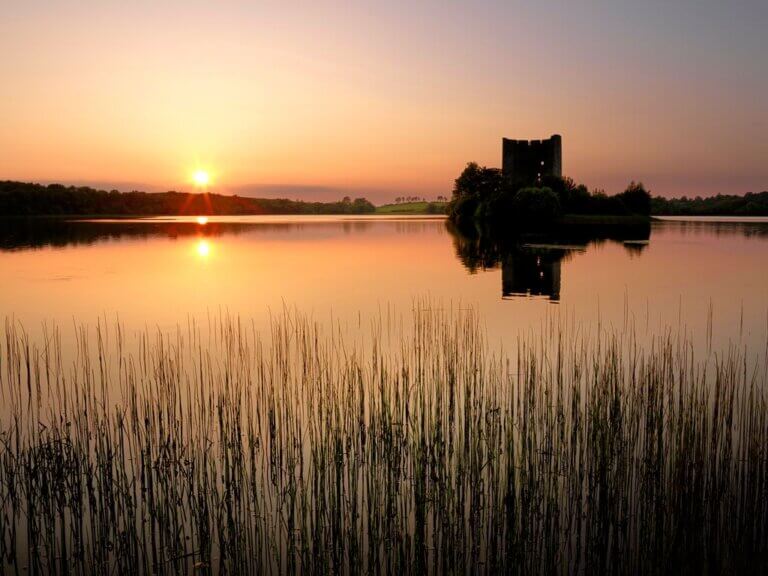a castle in the middle of a lake Cavan Day