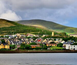 a town with hills in the background Dingle native and tour guide