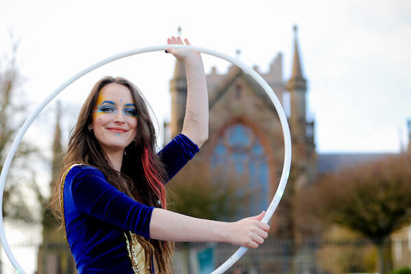 a girl holding a hoop Armagh City
