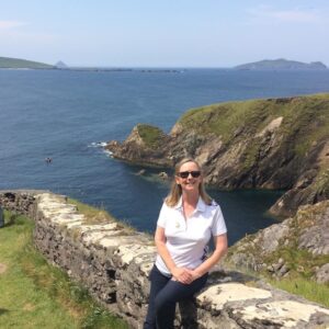 a woman sitting on a wall Meet Mary G