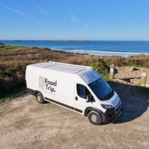 a van parked in a lot road tripping around Ireland